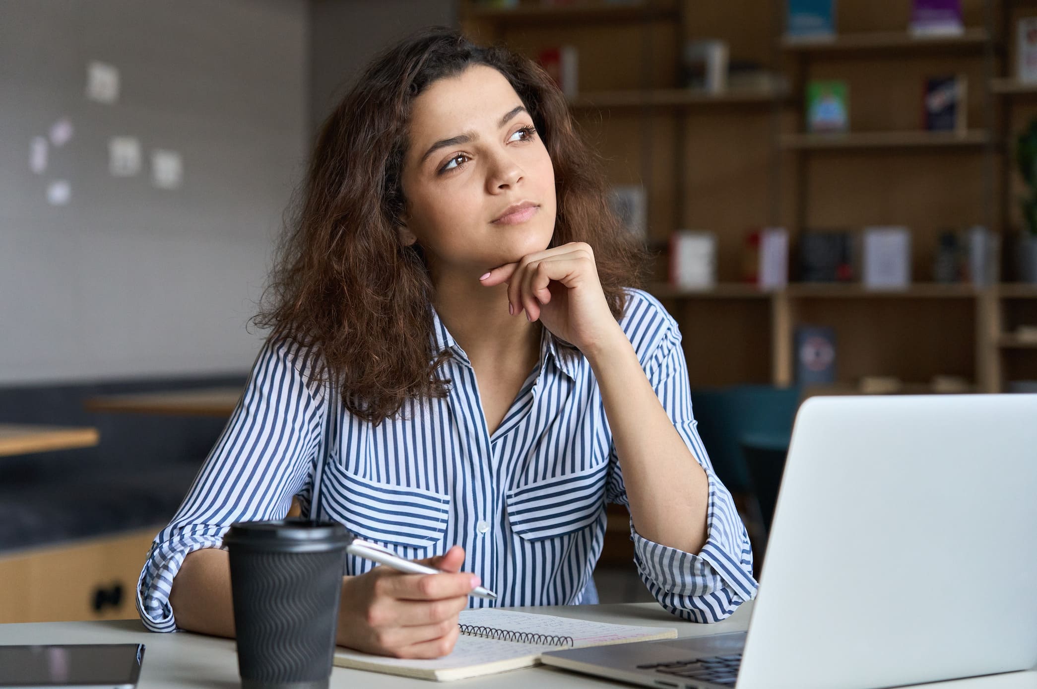 Woman journaling to manage emotions